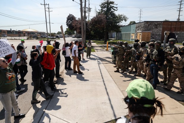 Federal agents head back into to the Immigration and Customs...