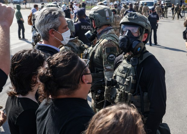 Evanston Mayor Daniel Biss stands face to face with federal agents during a protest outside the Immigration and Customs Enforcement facility in Broadview on Sept. 12, 2025. (Dominic Di Palermo/Chicago Tribune)