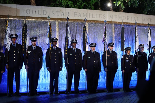 Chicago police officers attend the Chicago Police Memorial Foundation's annual candlelight vigil at the Gold Star Families Memorial beside Soldier Field on Sept. 10, 2025. (Chris Sweda/Chicago Tribune)