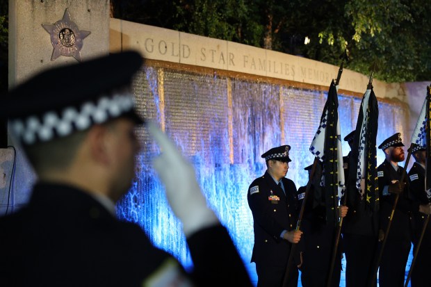 Chicago police officers attend the Chicago Police Memorial Foundation's annual candlelight vigil at the Gold Star Families Memorial on Sept. 10, 2025. (Chris Sweda/Chicago Tribune)