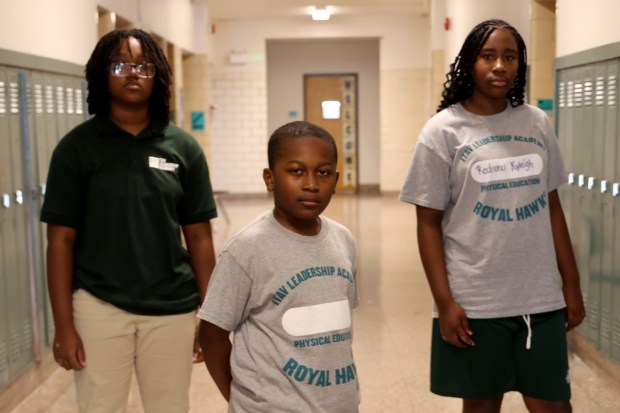Middle school students from It Takes a Village Leadership Academy in Bronzeville, Lyric Amparan, Kayden Mayo, and Kyleigh Redmond discussed the possible threat of a National Guard deployment to Chicago. (Antonio Perez/Chicago Tribune)