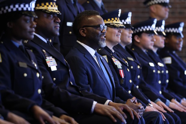 Mayor Brandon Johnson and Chicago Police Superintendent Larry Snelling pose for photos before the start of the Chicago Police Department's graduation and promotion recognition ceremony at Navy Pier in Chicago on Feb. 3, 2025. (Antonio Perez/Chicago Tribune)