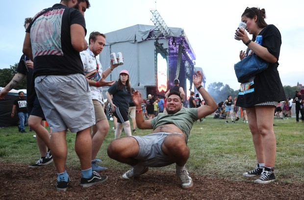 A group of friends have some fun at Riot Fest in Chicago's Douglass Park on Friday, Sept. 19, 2025. (Chris Sweda/Chicago Tribune)
