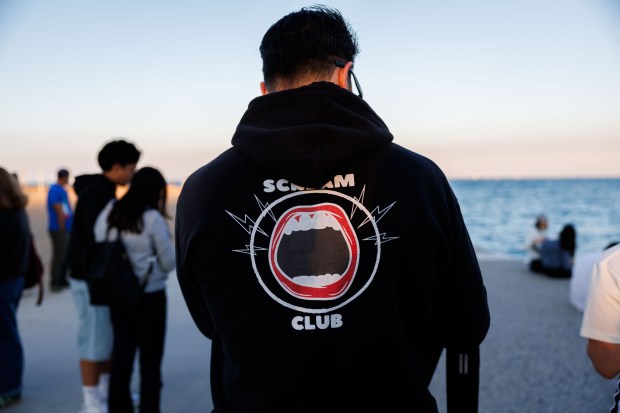 Co-founder Manny Hernandez wears a scream club hoodie before hosting the eleventh scream club gathering near North Avenue Beach on Aug. 31, 2025. (Armando L. Sanchez/Chicago Tribune)
