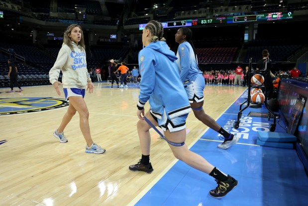 Sky strength and conditioning coach and VP of basketball operations Ann Crosby works with players during warmups for a game against the Connecticut Sun on Sept. 3, 2025, at Wintrust Arena. (Chris Sweda/Chicago Tribune)