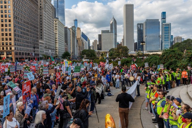 People gather near the Congress Plaza Gardens to protest President Donald Trump's intent to increase immigration enforcement actions in the city and deploy the National Guard, Sept. 6, 2025, in Chicago. (Armando L. Sanchez/Chicago Tribune)