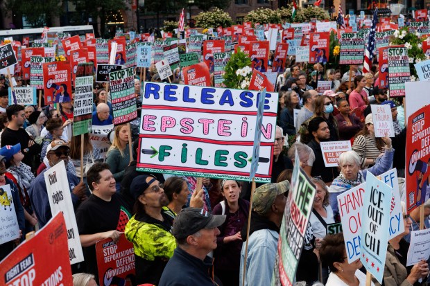 People gather near the Congress Plaza Gardens to protest President Donald Trump's intent to increase immigration enforcement actions in the city and deploy the National Guard, Sept. 6, 2025, in Chicago. (Armando L. Sanchez/Chicago Tribune)