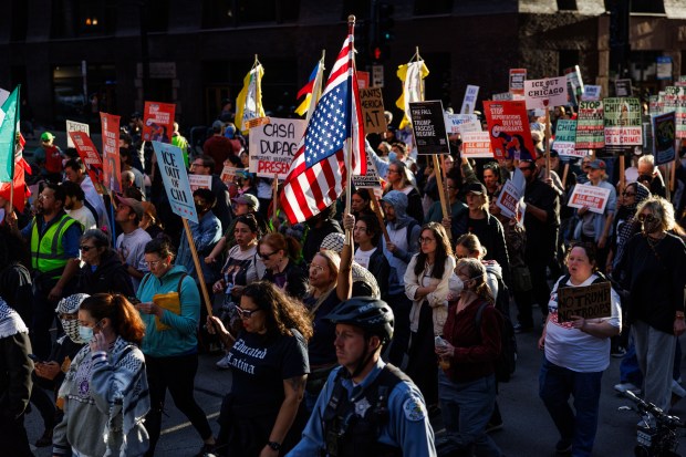 People march in the Loop to protest President Donald Trump's intent to increase immigration enforcement actions in the city and deploy the National Guard, Sept. 6, 2025, in Chicago. (Armando L. Sanchez/Chicago Tribune)