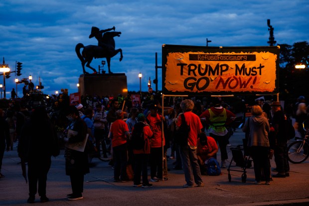 People gather near the Congress Plaza Gardens after protesting President Donald Trump's intent to increase immigration enforcement actions in the city and deploy the National Guard, Sept. 6, 2025, in Chicago. (Armando L. Sanchez/Chicago Tribune)
