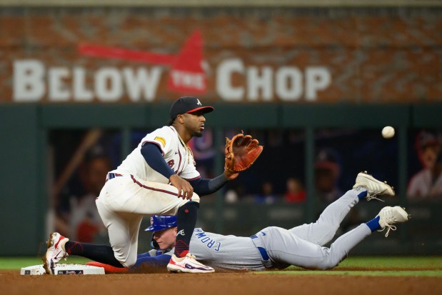 Pete Crow-Armstrong #4 of the Chicago Cubs beats the throw to Ozzie Albies #1 of the Atlanta Braves for a stolen base in the fifth inning of a game against the Atlanta Braves at Truist Park on Sept. 9, 2025 in Atlanta, Georgia. (Photo by Edward M. Pio Roda/Getty Images)
