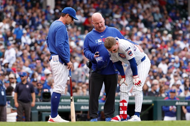 Cubs center fielder Pete Crow-Armstrong is tended to by medical staff after fouling a ball off his right knee during the sixth inning against the Nationals on Sept. 6, 2025, at Wrigley Field. (Sage Zipeto/Getty Images)