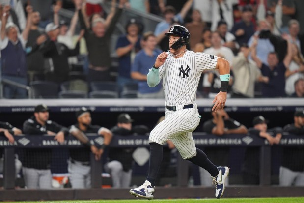 New York Yankees' Aaron Judge runs to home plate to score on a walk-off RBI single during the ninth inning of a baseball game against the Chicago White Sox Tuesday, Sept. 23, 2025, in New York. (AP Photo/Frank Franklin II)