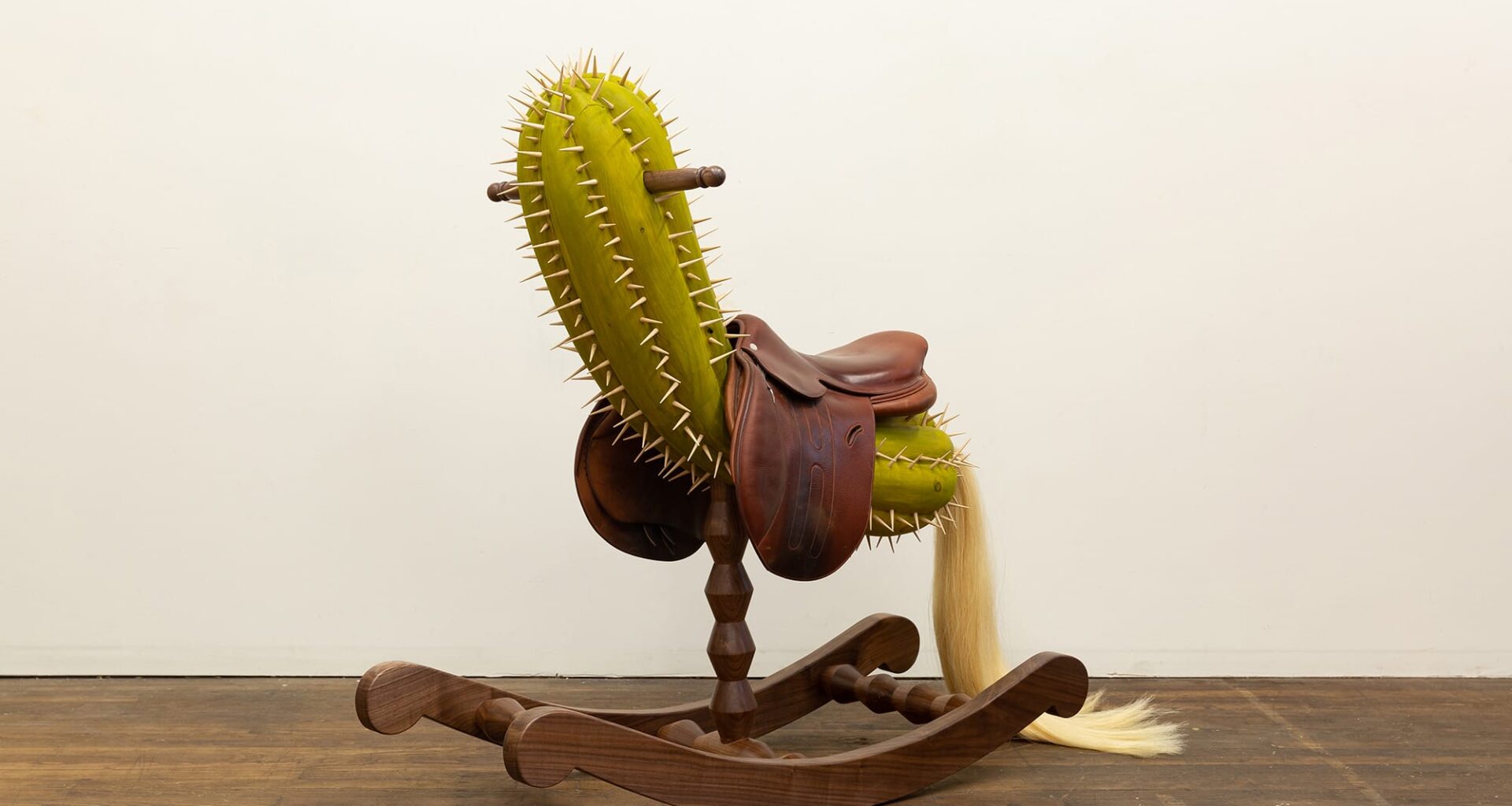 a rockinghorse like sculpture with a cactus seat by Raul De Lara