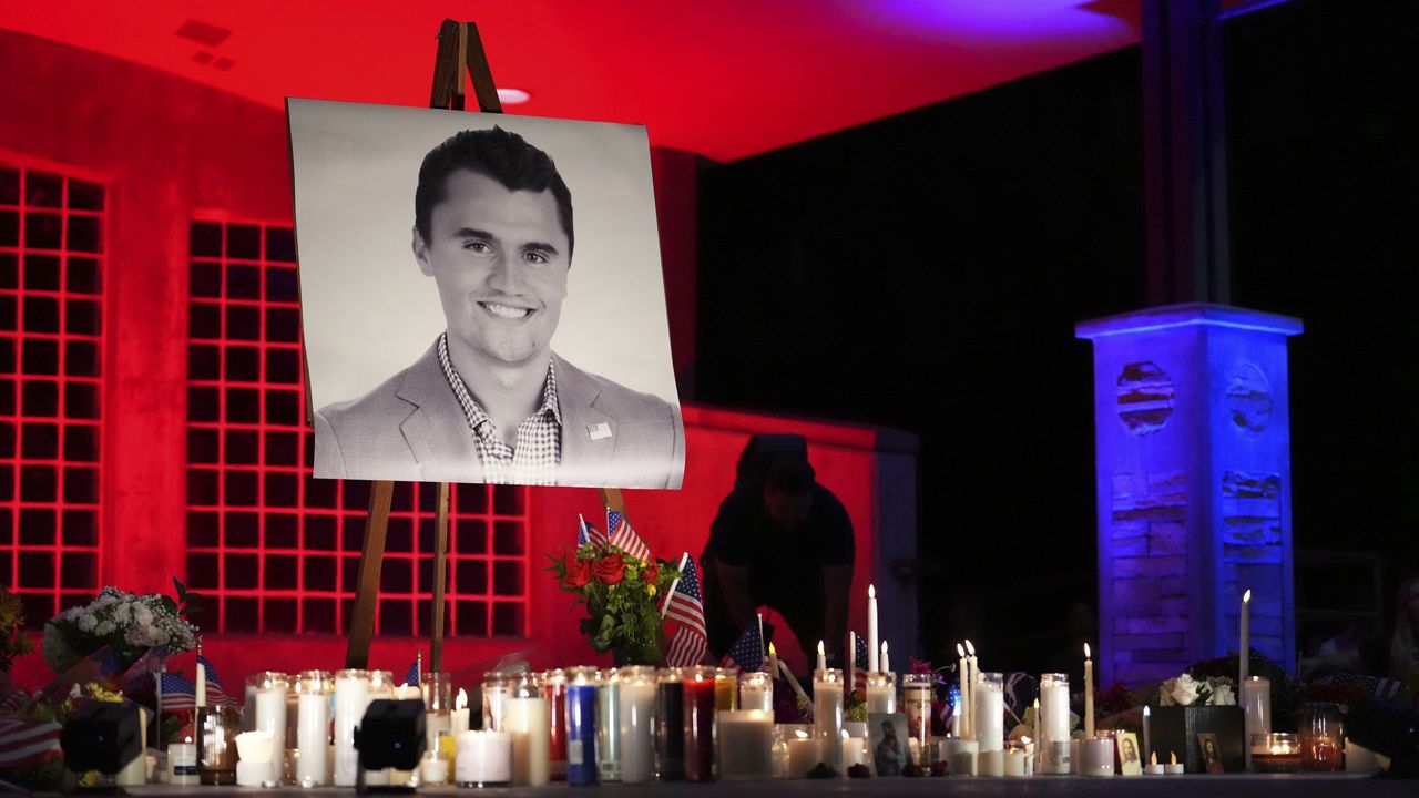 A photo of Charlie Kirk, the CEO and co-founder of Turning Point USA who was shot and killed, stands at his vigil, Thursday, Sept. 11, 2025, in Orem, Utah. (AP Photo/Lindsey Wasson)