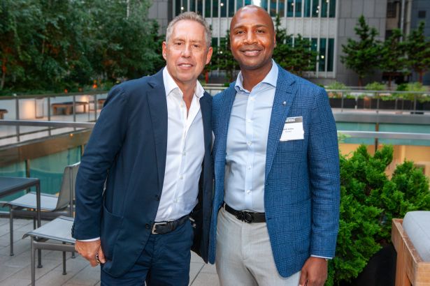 Impact Front and Center at Commercial Observer’s Power Gala Two men standing side by side at an event.