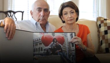 Ellen Greenberg's parents, Joshua and Sandra Greenberg, hold a photo album of their daughter.