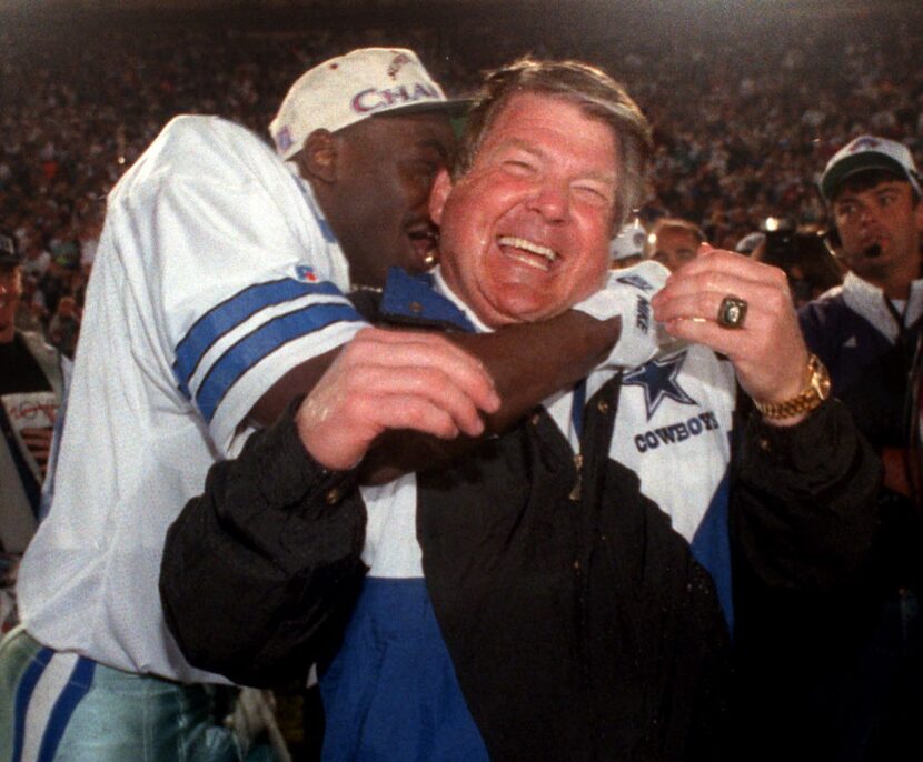 Cowboys coach Jimmy  Johnson gets a big hug from wide receiver Michael Irvin following ...