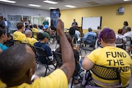 Members of environmental justice group Downwinders At Risk listen to District 7 council...