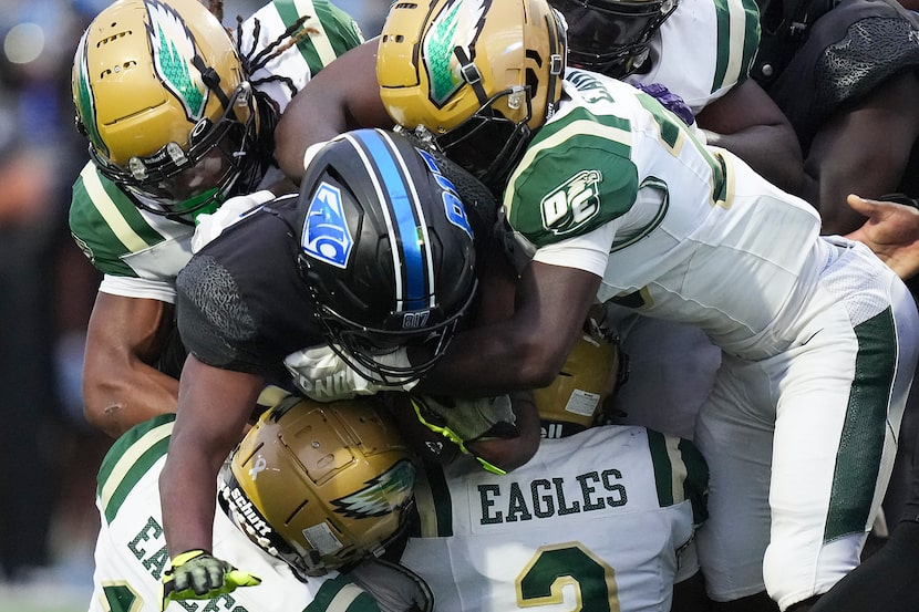 North Crowley running back Kiante Ingram (23) is wrapped up by the DeSoto defense during the...