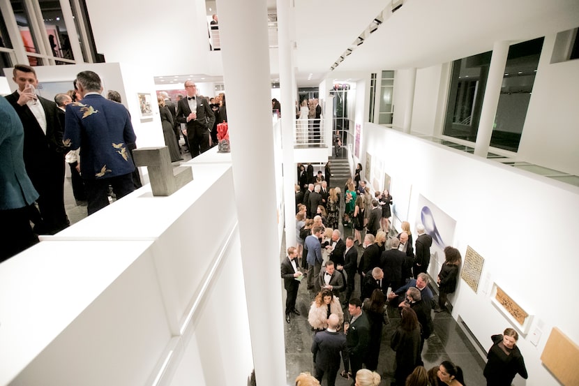 A crowd gathers inside the Rachofsky house for the 2017 gala, Two x Two for AIDS and Art....