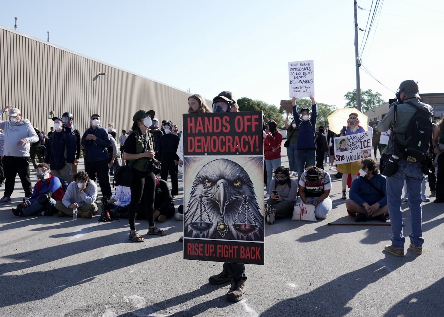 People protest outside a federal immigration enforcement building in Broadview, Ill. on Friday, Sept. 26, 2025. 