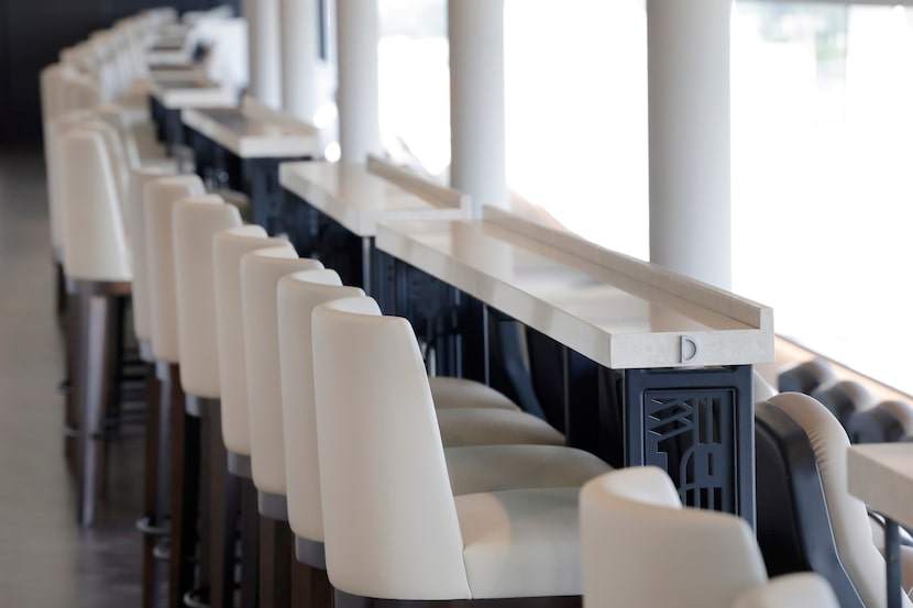 The Club Level has custom fabricated drink rails feature end panels designed with a pattern...