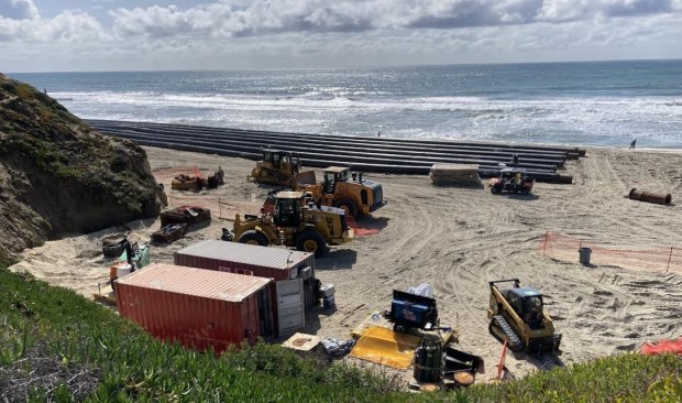Pipes and equipment at Fletcher Cove in Solana Beach during a 2024 sand replenishment project.
