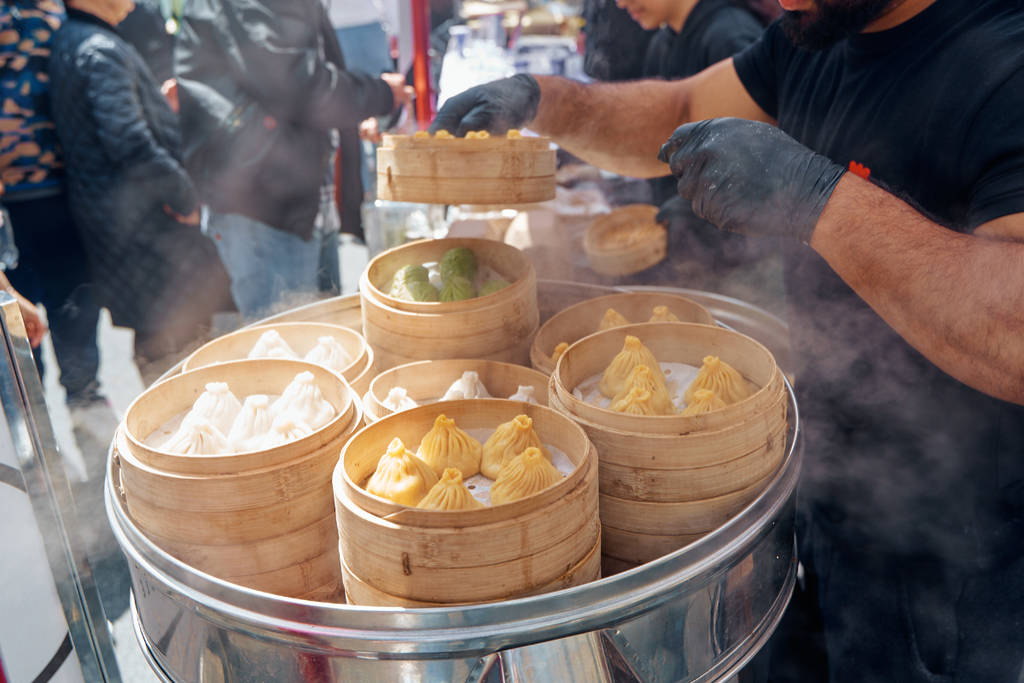 Image shows a tray holding crates of steamed dumplings at Panda Fest.