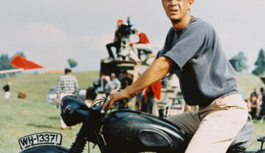 Actor Steve McQueen sitting astride a motorcycle in a publicity still for the 1963 film The Great Escape.