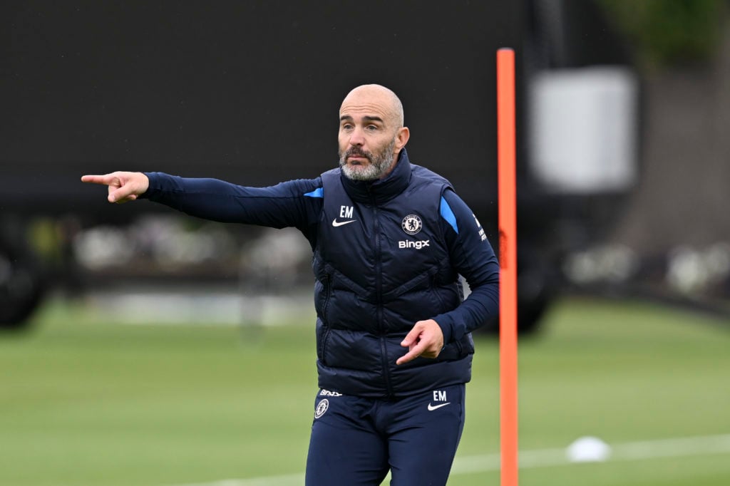 Chelsea head coach Enzo Maresca working on the training pitch at Cobham.