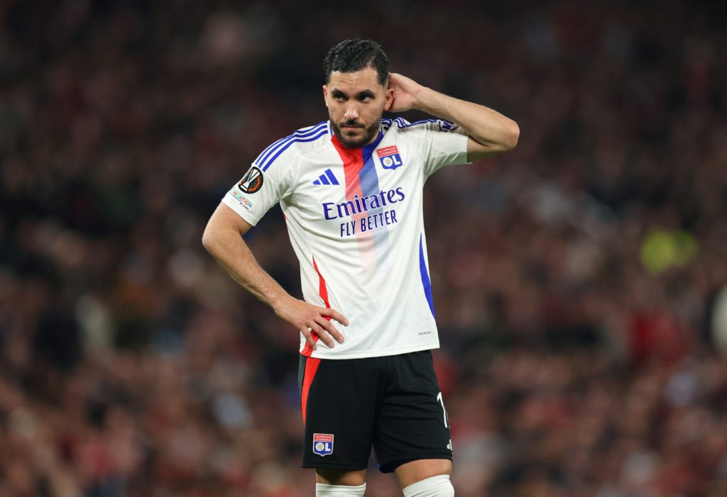Rayan Cherki playing for Lyon, looking dejected