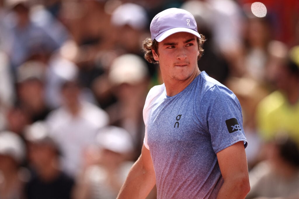 Joao Fonseca looks on as he plays against France's Pierre-Hugues Herbert during their men's singles match on day 5 of the French Open tennis tournament at the Roland-Garros Complex in Paris.