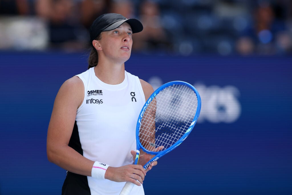 Iga Swiatek of Poland looks on against Emiliana Arango of Colombia during their Women's Singles First Round match on Day Three of the 2025 US Open at USTA Billie Jean King National Tennis Center.