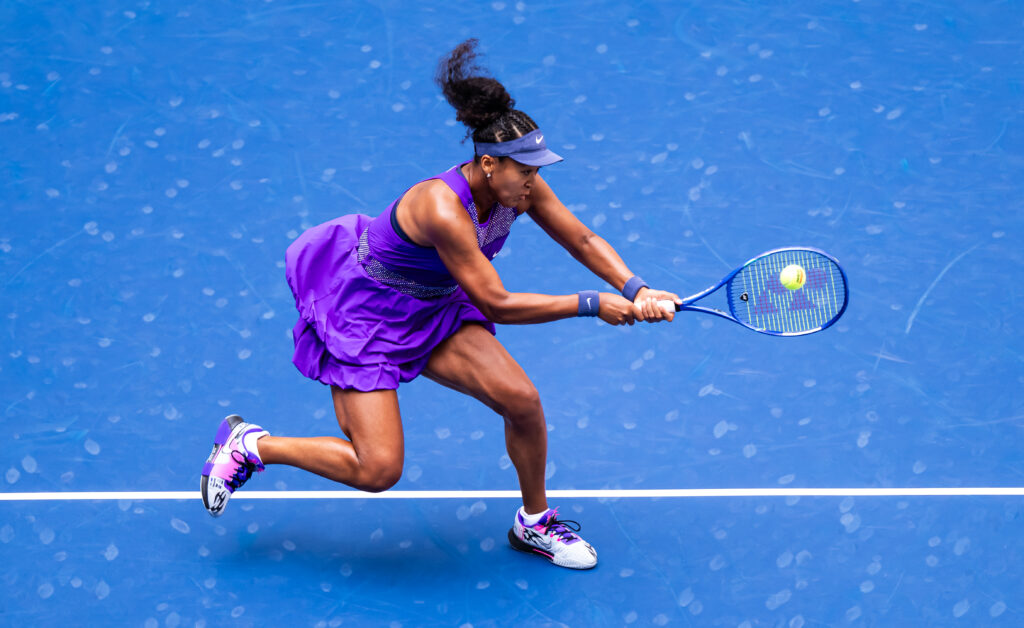 Naomi Osaka hits a backhand
