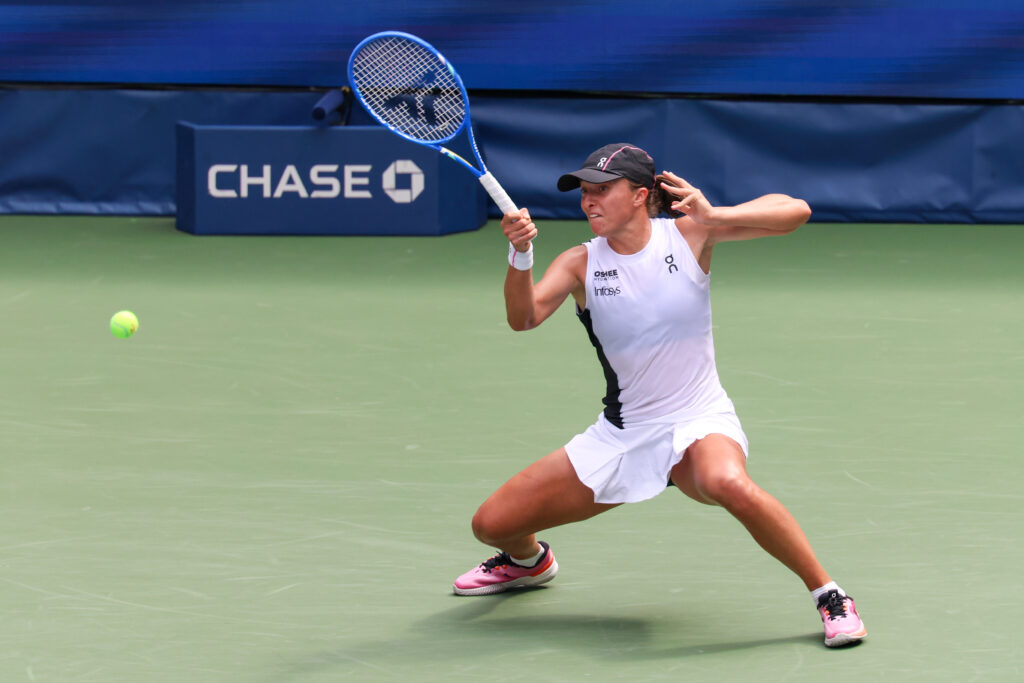 Iga Swiatek hits a forehand