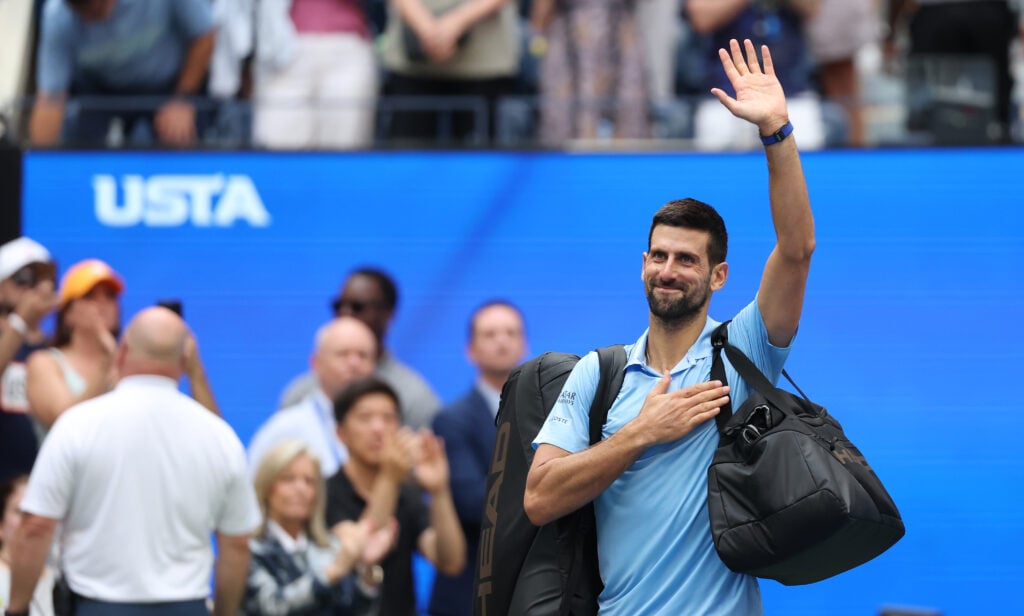 Novak Djokovic acknowledges the crowd after losing to Carlos Alcaraz at the 2025 US Open