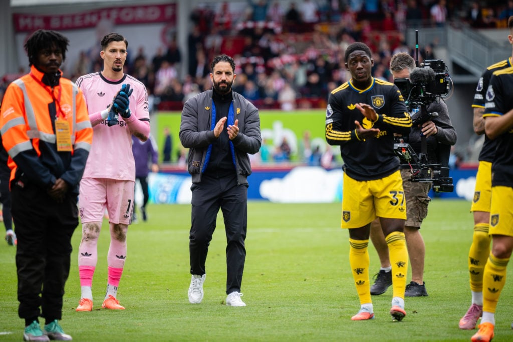 Ruben Amorim applauds Manchester United supporters after loss to Brentford.