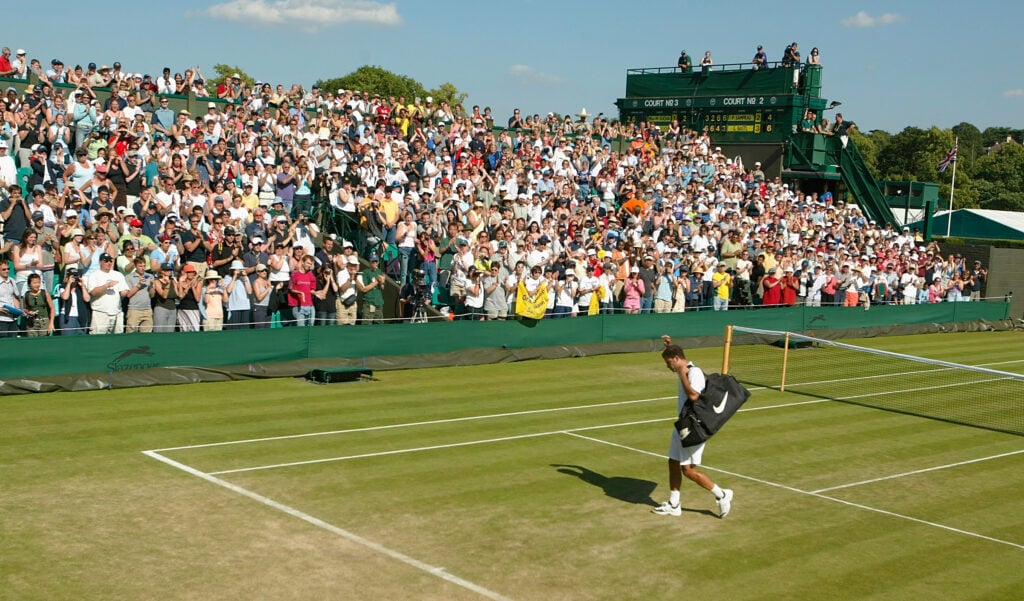 Pete Sampras of the USA walks off the court after his defeat against George Bastl of Switzerland at the All England Tennis Championships at the All England Lawn Tennis Club.