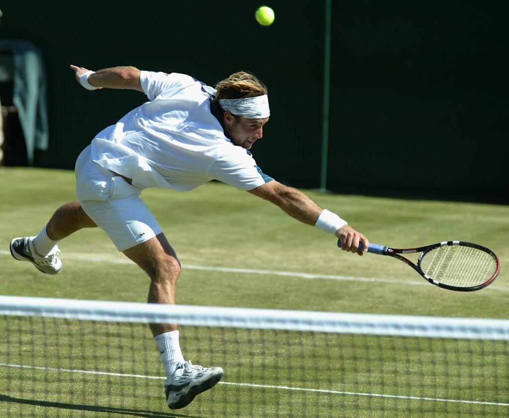 George Bastl of Switzerland in action on his way to victory over Pete Sampras of the USA at the All England Tennis Championships at the All England Lawn Tennis Club.