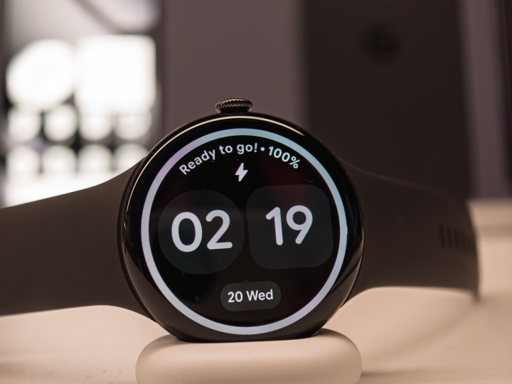 Google Pixel Watch 4 in black on a charger
