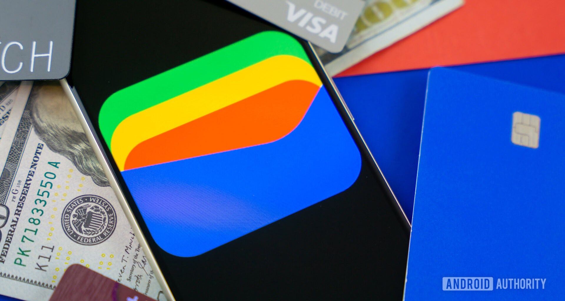 Google Wallet logo on smartphone next to credit cards and cash Stock photo 8