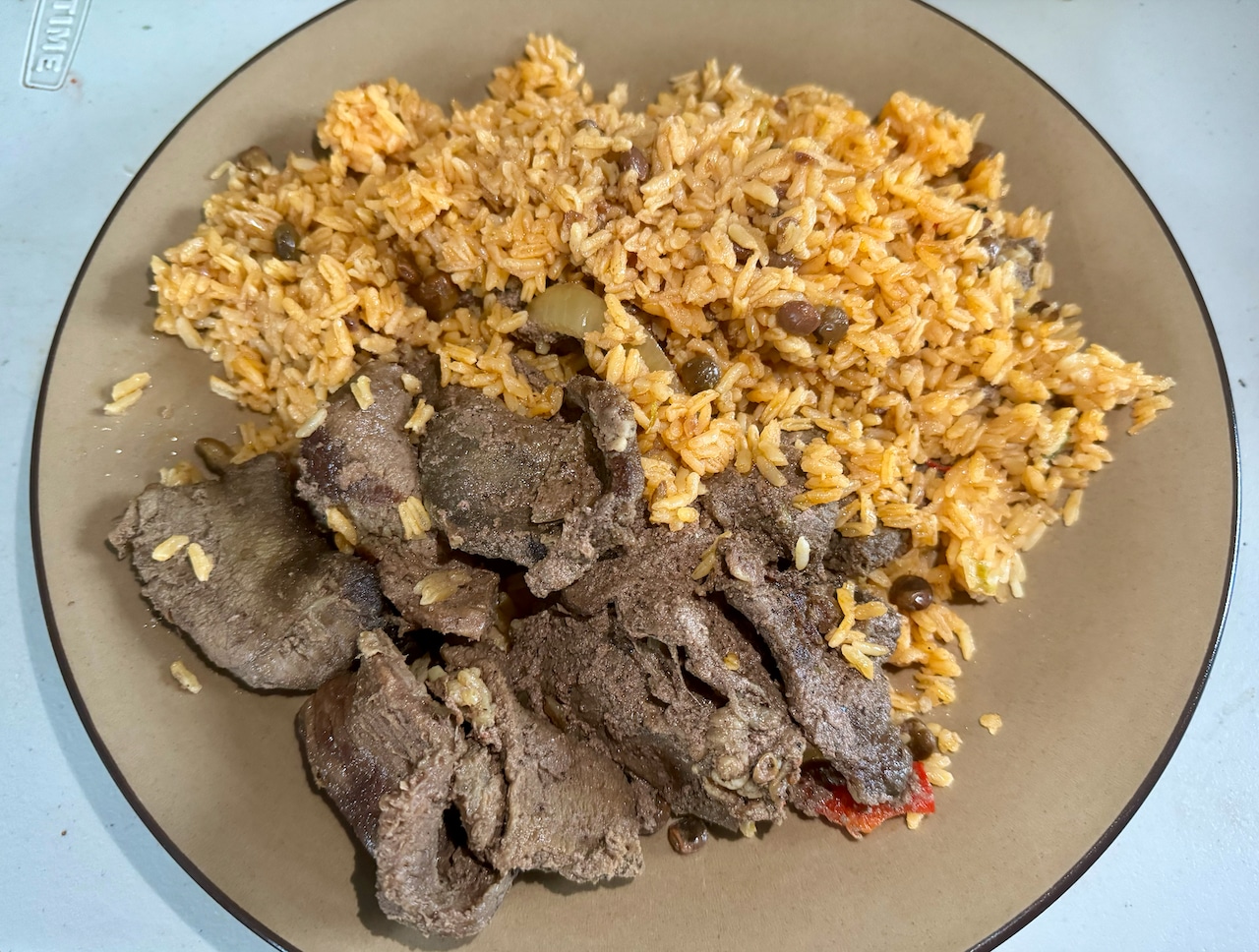 The beef steak and rice and pigeon peas from Nino de oro Dominicano in Plainfield