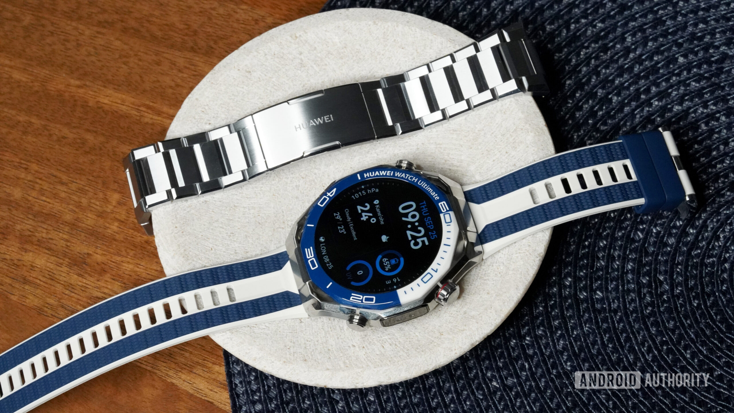 A Huawe Watch Ultimate 2 rets alongside an alternate band option.