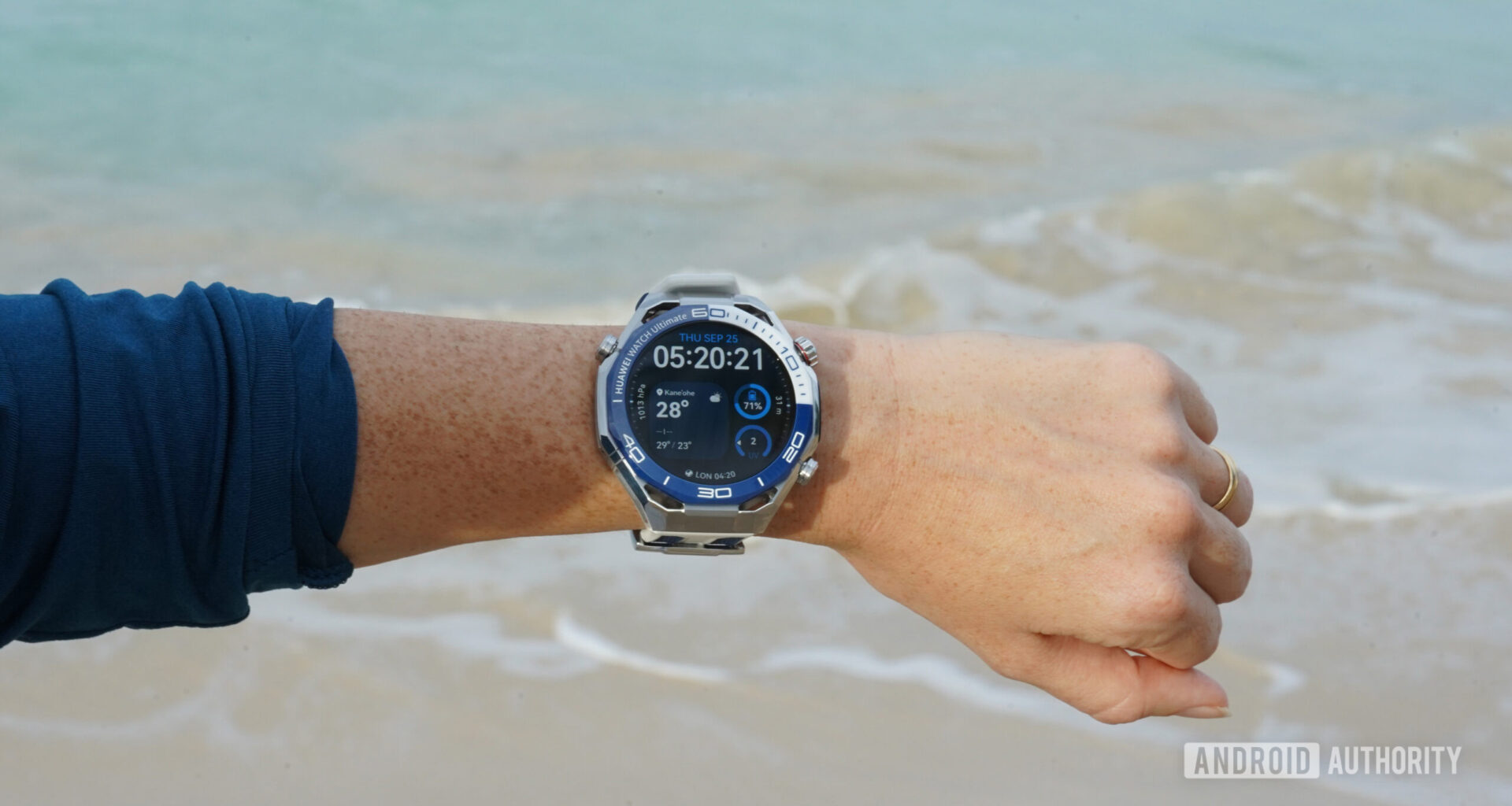 A Huawei Watch Ultimate displays a user's watch face.
