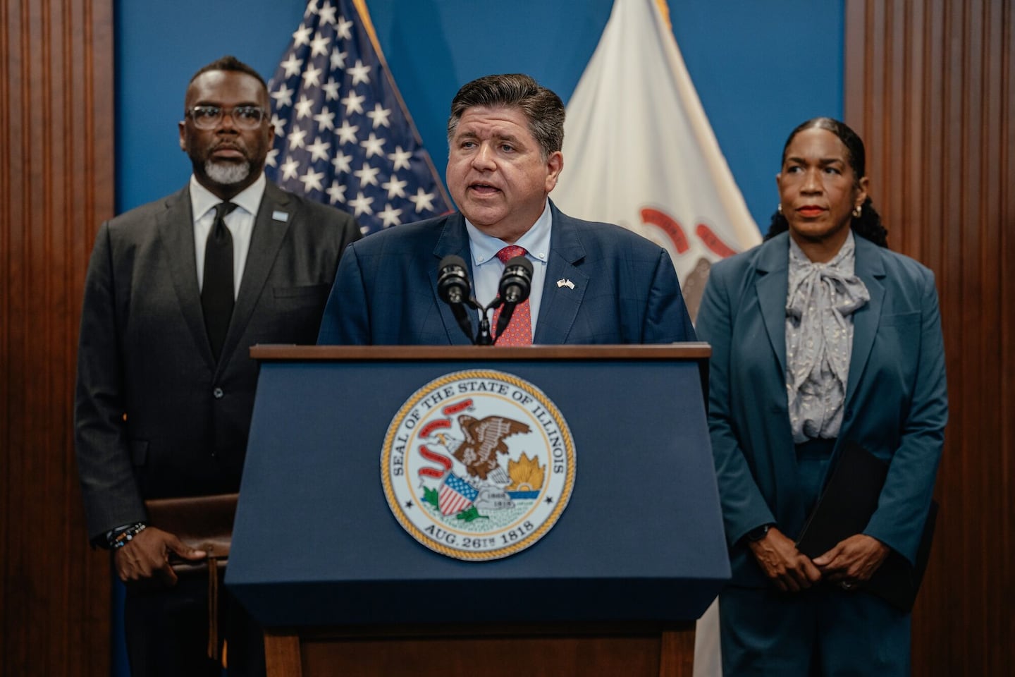 JB Pritzker, governor of Illinois, center, speaks during a news conference in Chicago.