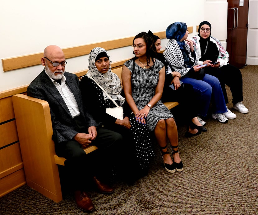 Family members of Raunaq Alam and others wait outside the courtroom in Fort Worth to urge...