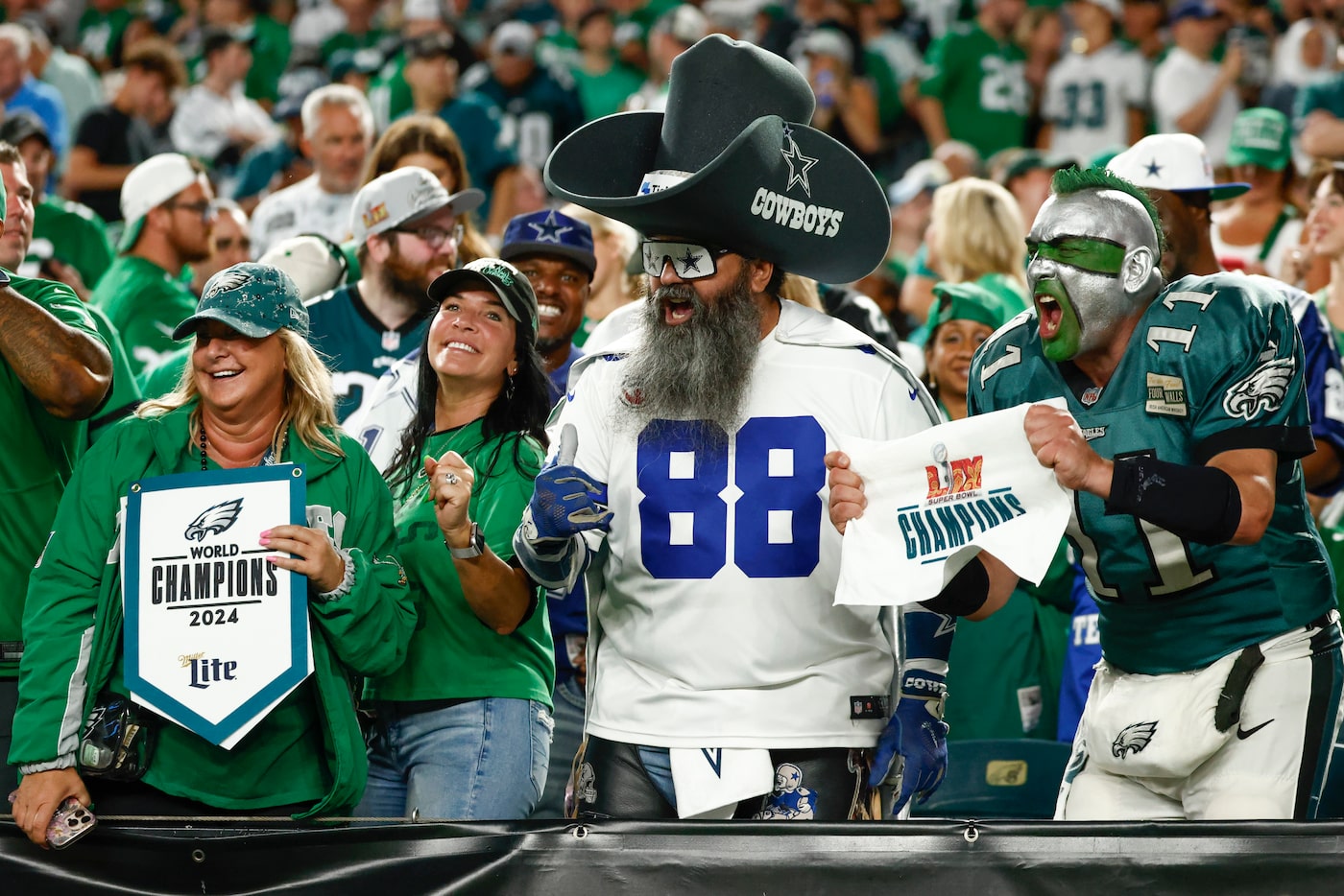 Fans cheer before the first half of an NFL game between the Dallas Cowboys and the...