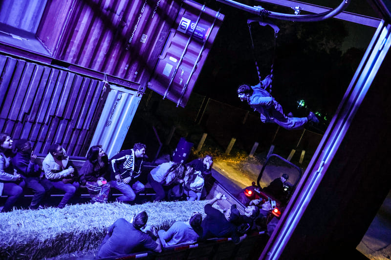 A monster hangs from a harness above the Los Angeles Haunted Hayride
