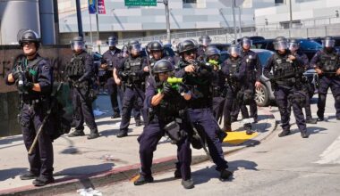 FILE - Police defend the Metropolitan Detention Center in downtown Los Angeles, June 8, 2025, following an immigration raid protest the previous day.(AP Photo/Jae Hong, File)