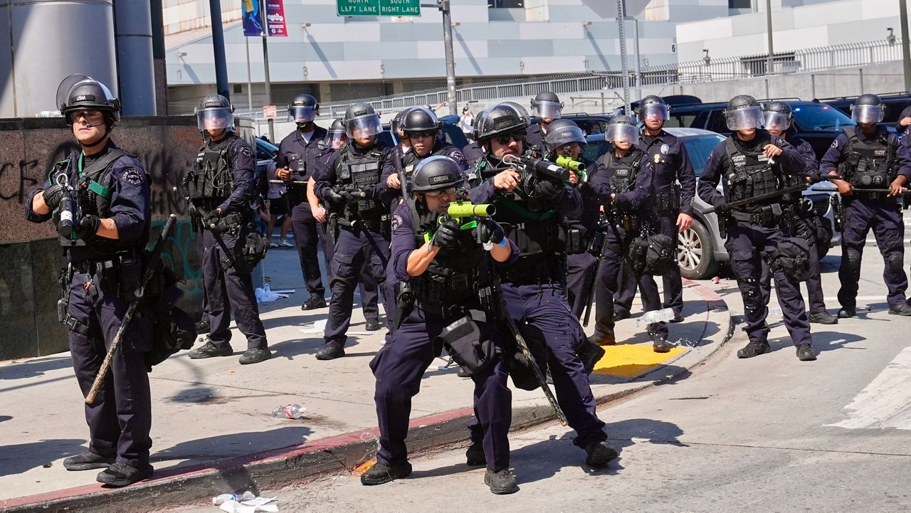FILE - Police defend the Metropolitan Detention Center in downtown Los Angeles, June 8, 2025, following an immigration raid protest the previous day.(AP Photo/Jae Hong, File)